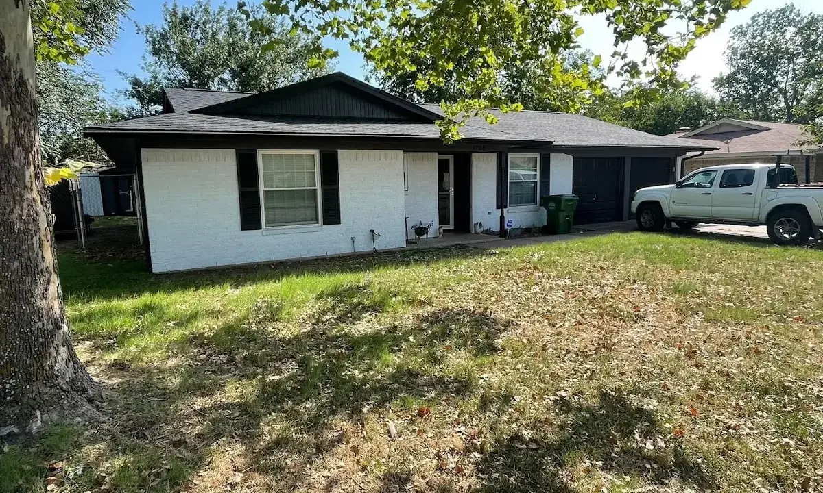 Professional roofing crew working on a residential roof in Davie